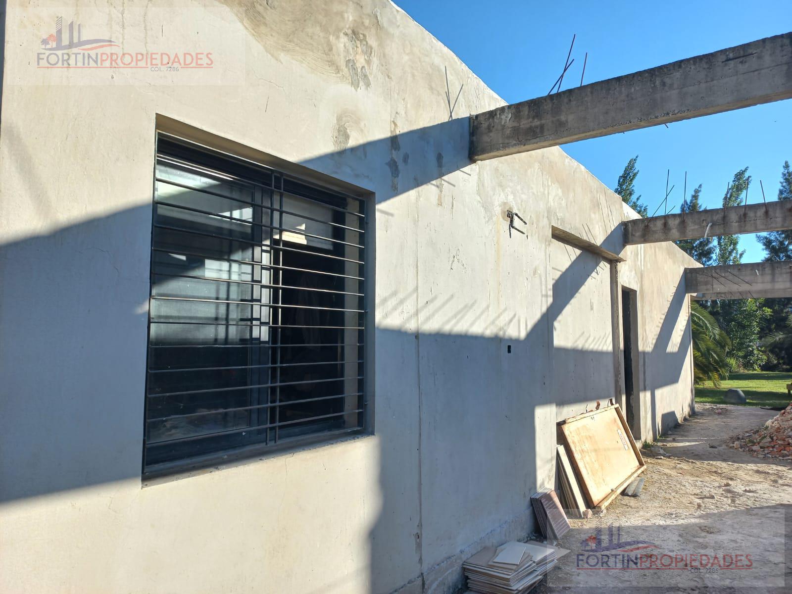 LOTE CON CONSTRUCCION en GONNET